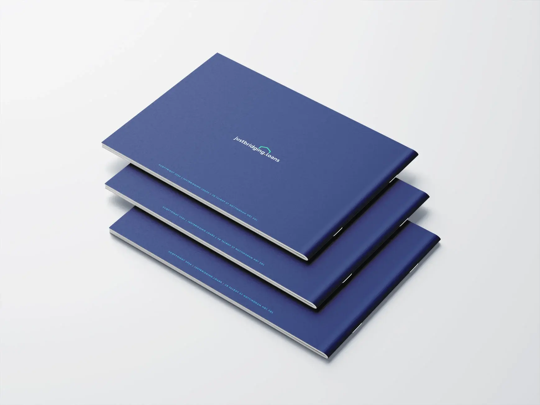 Three blue books arranged neatly on a matching blue background, creating a harmonious visual effect.