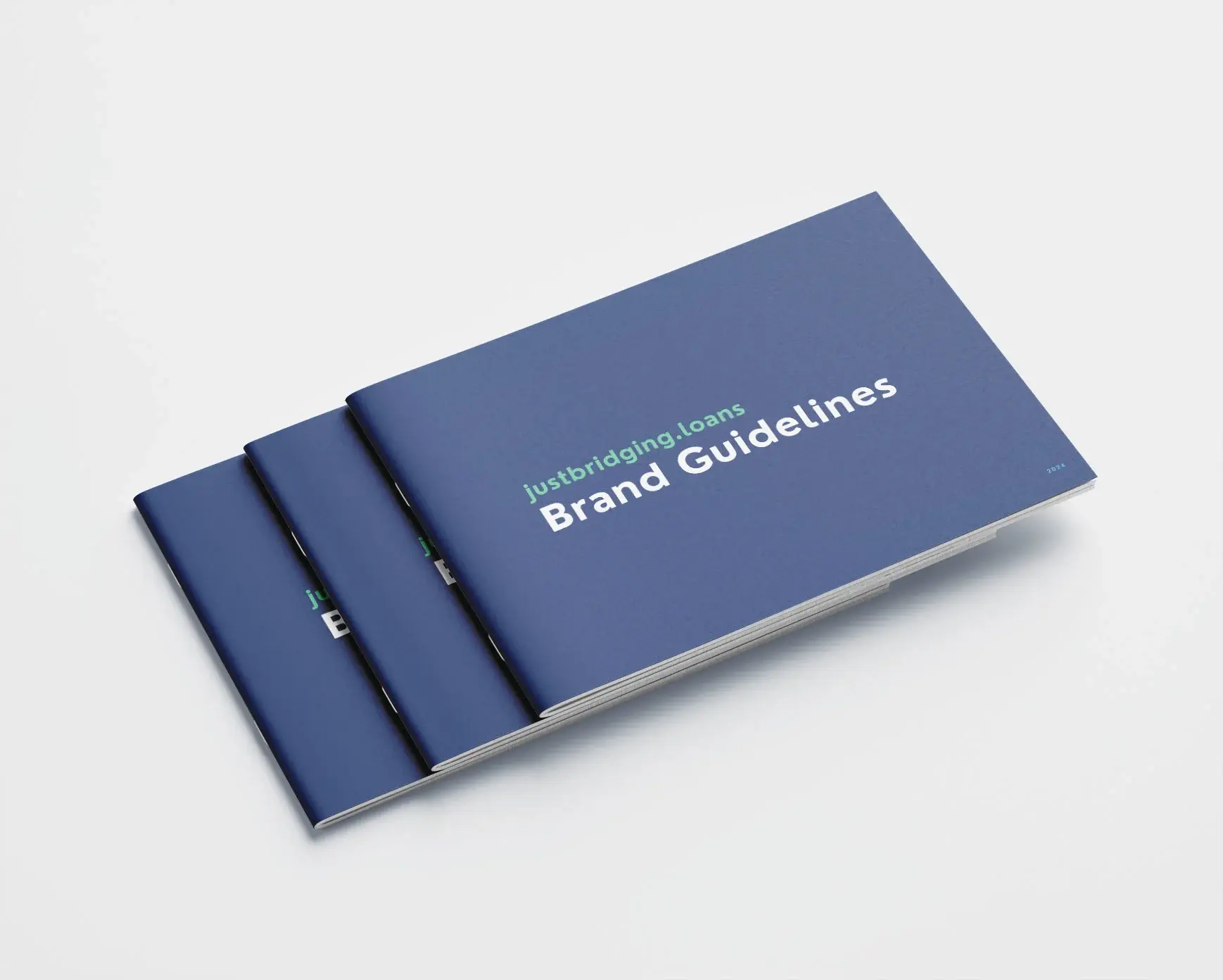 A mockup of a brand guidelines book showcasing design elements and colour palettes for visual identity